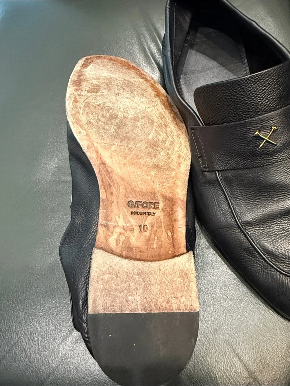 G/FORE Black Leather Slip-On Loafers with Gold Cross Accent